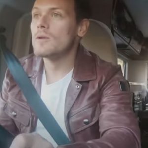 men in kilts a roadtrip with sam and graham sam heughan purple jacket